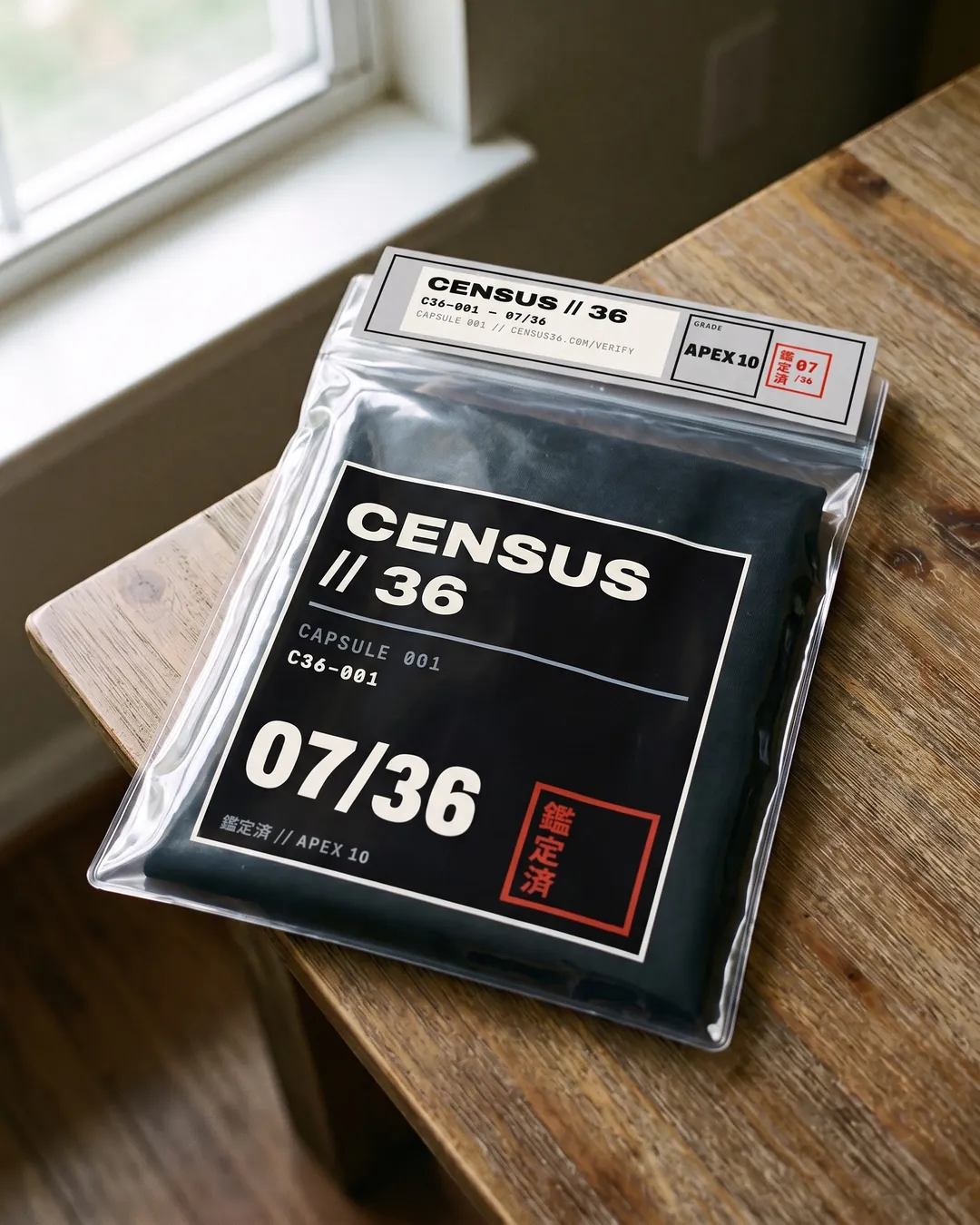 C36-001 folded in a clear collector sleeve with the numbered header seal, chest box No. 07/36 in focus